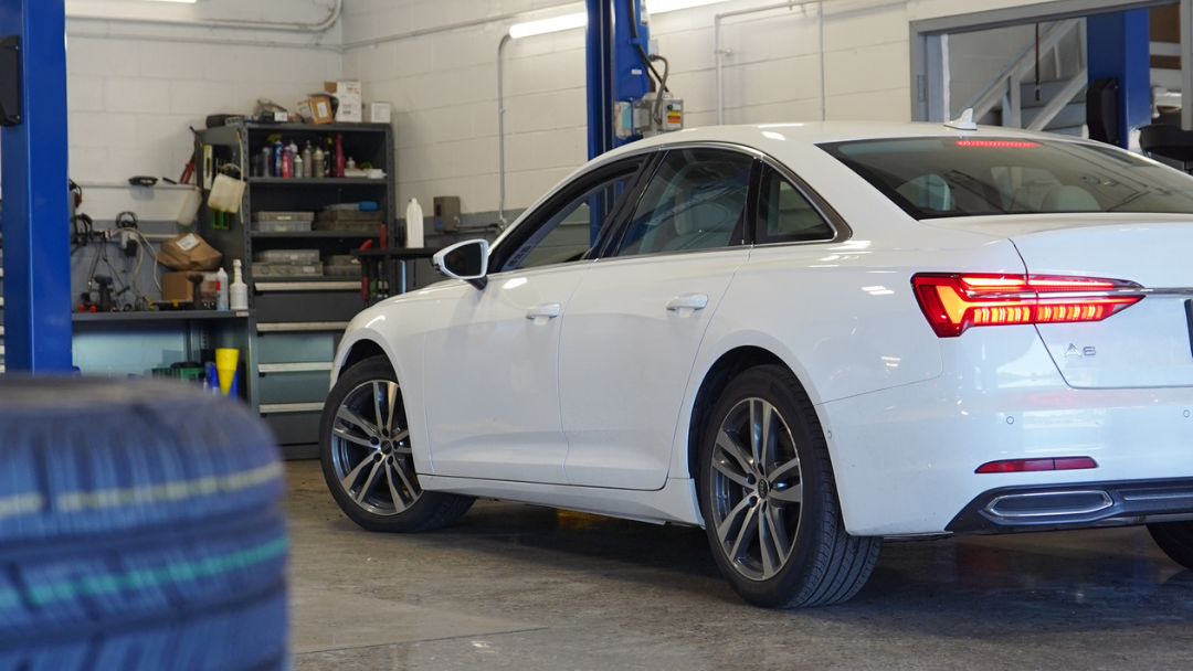 A white car in a garage.